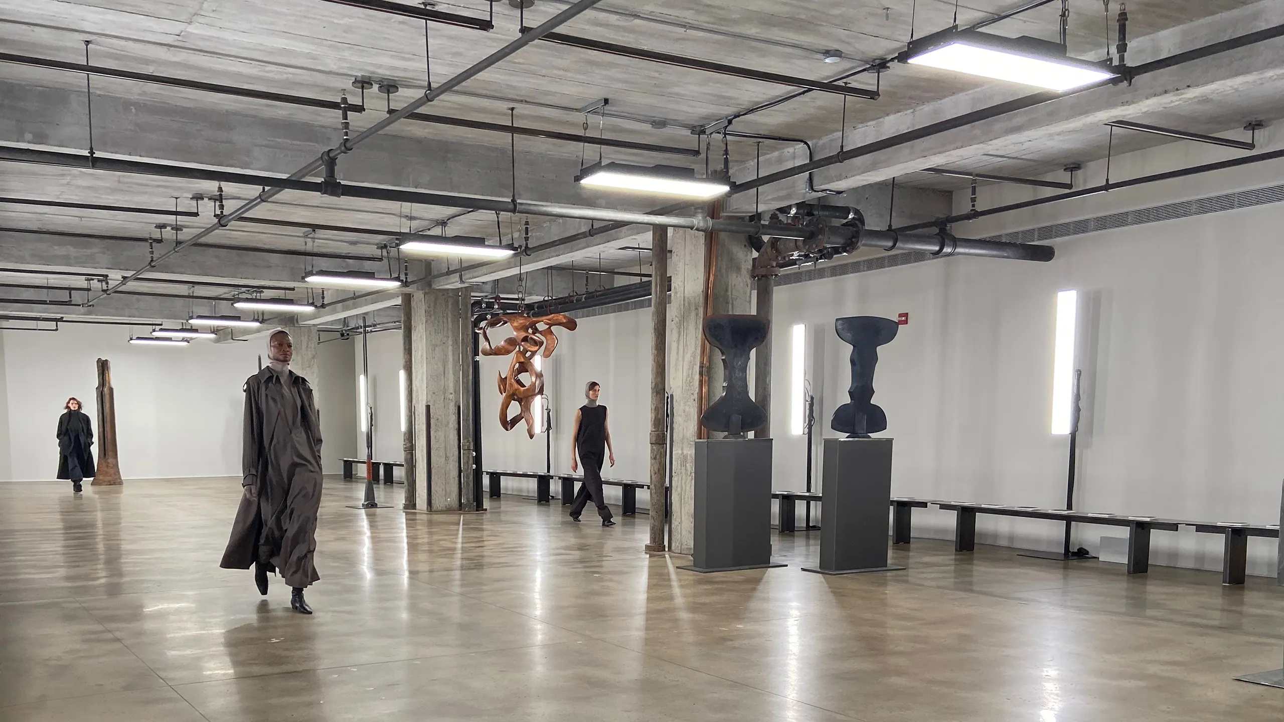 Ready-to-wear models walk runway in art gallery